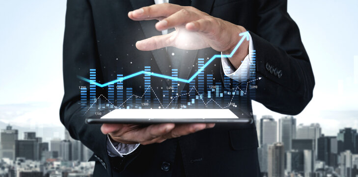 A businessman in a formal suit holds a digital tablet displaying a growth chart with futuristic graphics, representing business analysis against a vibrant urban skyline. Scalp