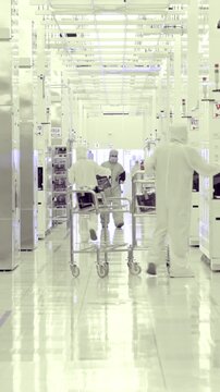 Vertical footage of workers in a Semiconductor manufacturing facility
