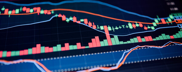 Financial market data and trading graph on a computer screen, close-up view