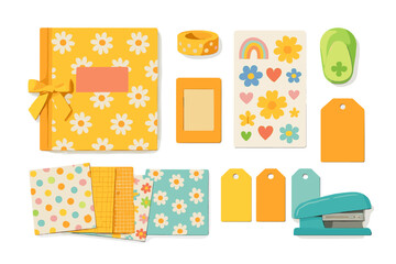 Flat lay of colorful retro scrapbooking supplies including daisy patterned album, stickers, tags, and stapler