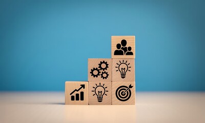 Wooden blocks with business icons representing growth, ideas, and teamwork on blue background.