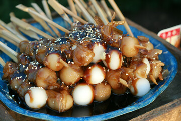 Mitarashi dango skewers glazed with sweet soy sauce, delightful treat for all