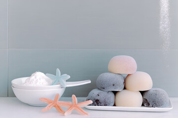 Mochi dessert with pastel colors and powdered sugar creates delightful scene