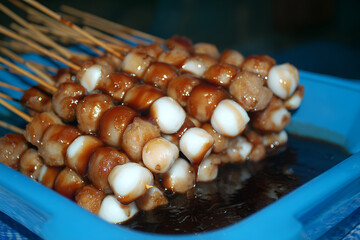 Mitarashi dango skewers glazed with sweet soy sauce, delightful treat for dessert lovers