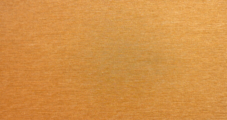 The texture of the golden metallic background for the text. Gold plating.