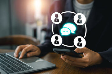 A professional using a laptop and smartphone, symbolizing modern digital communication and connectivity in a business environment.