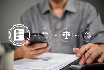 Businessman hand using smartphone calculator for tax payment, mobile banking. Virtual interface icon checklist, bank, legal, investment. Financial technology (Fintech) concept, document analysis.