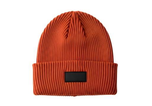 Orange knitted beanie hat with black patch isolated on transparent background