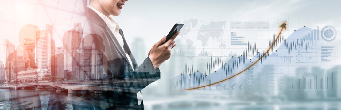 A business professional engaged with a smartphone in a contemporary office setting, highlighting financial graphs and an urban landscape, representing modern success. Scalp - Powered by Adobe