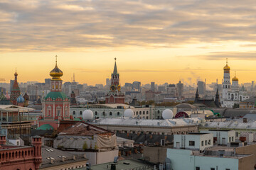 Moscow cityscape at sunset with historical roofs and towers