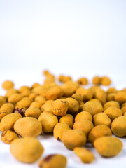 Crispy seasoned peanuts piled high, a delicious snack perfect for sharing or enjoying solo, offering a satisfying crunch with every bite for any occasion.