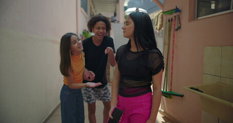 Teenagers mocking friend over unflattering photo reveal on smartphone in suburban alleyway, highlighting social dynamics, peer pressure, and media influence