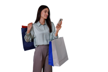 Woman holding shopping bags and smartphone, checking phone while shopping, standing for retail e-commerce