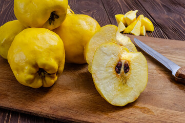 Fresh Quince Fruit on Wooden Cutting Board