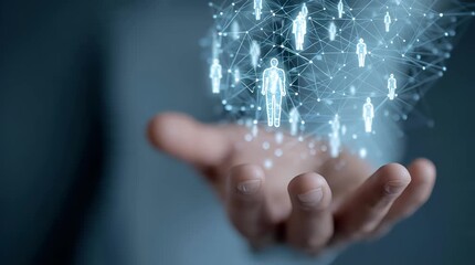 Close Up of Hand with Hologram People Icons Connected by Lines for Recruitment Concept	 - Powered by Adobe