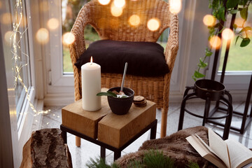 Cozy reading nook with comfortable furnishings and natural light. Background for leisure and relaxation.