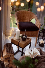 Cozy reading nook with comfortable furnishings and natural light. Vertical background for leisure and relaxation.