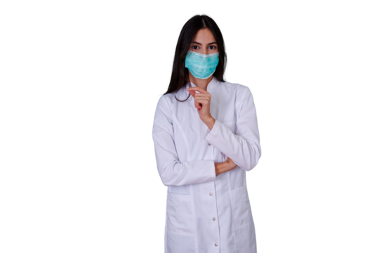 Woman doctor in lab coat and face mask pondering a medical decision, offering healthcare and professional concepts - Powered by Adobe