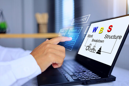 WBS work breakdown structure concept with hand pointing to works on laptop screen to analyze project task to break down work details on virtual interface