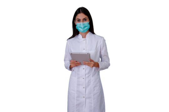 Woman doctor in medical uniform and facial mask, using a tablet, highlighting telehealth, technology in healthcare - Powered by Adobe