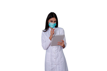 Doctor woman in lab coat wearing face mask, thinking and holding tablet for telemedicine and healthcare innovation