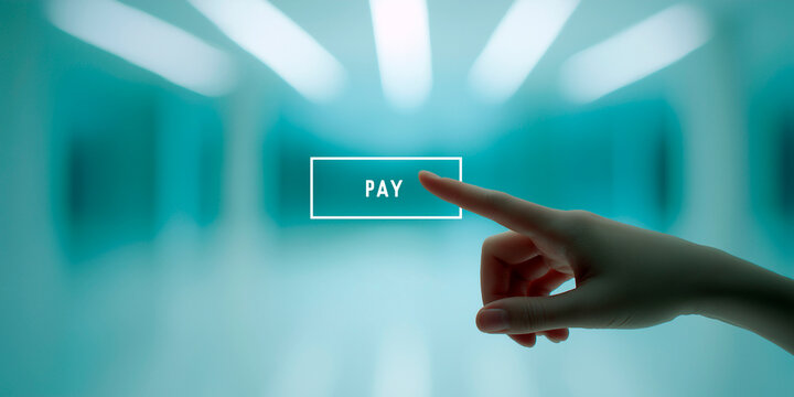 Finger touching virtual pay button on digital interface with futuristic glowing blue background representing online payment technology