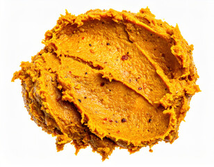 Fototapeta premium Vibrant macro shot of yellow curry paste with rich texture. delicious food ingredient full of aromatic spice, isolated on white background for cooking
