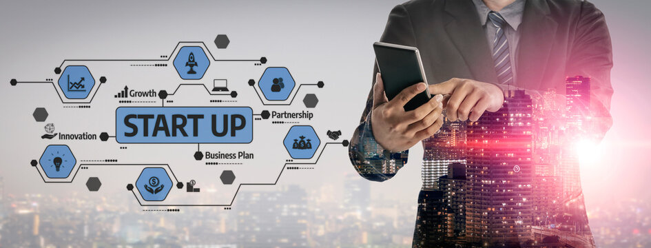 A professional businessman engaged with a smartphone, surrounded by futuristic startup icons. The image represents innovation and growth in an urban business environment. Tessel