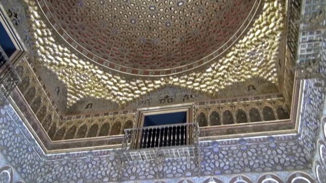 Hall of the Ambassadors (Salon de los Embajadores) royal palace of Pedro I of Castile. 14th century ceiling with a golden dome. Moorish Royal Alcazar palace of Seville, Andalusia, Spain, Europe. 