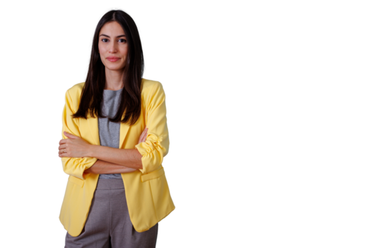 Woman standing confidently, wearing a yellow blazer, smiling with arms crossed. Portrait on transparent background