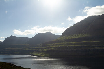 Fototapeta premium Fjord and steep mountains on Viðoy, a popular travel and hiking location in the Faroes.