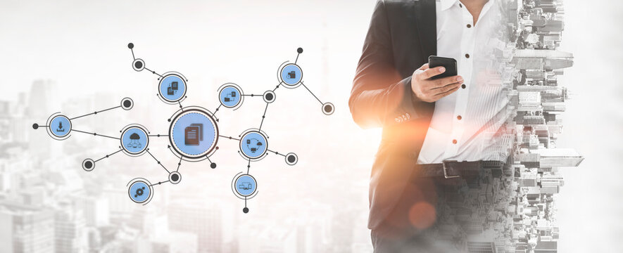A business professional interacts with a smartphone against a modern cityscape, featuring digital connections that symbolize innovation and technology in communication. Tessel