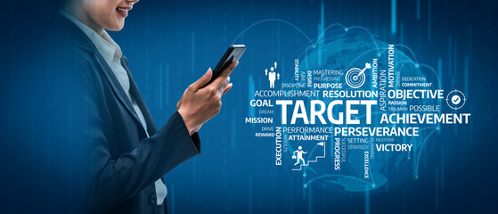 This image captures a businessperson using a smartphone against a backdrop of motivational words related to target achievement, success, and goal setting, symbolizing modern productivity. Tessel