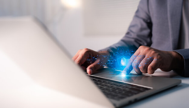 Hand of a man using laptop, secure access to user personal information, secure Internet access, information security encryption. Cybersecurity internet network data privacy concepts.