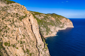 Aerial View of Cala d'Albarca (Cala Aubarca) and its Natural Stone Bridge in the Es Amunts Wild Area of Northern Ibiza