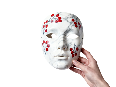 Hand holding a white theatrical mask with red floral decorations isolated on transparent background