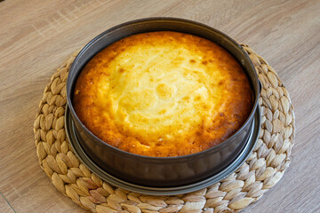 Homemade cheesecake in a baking tin