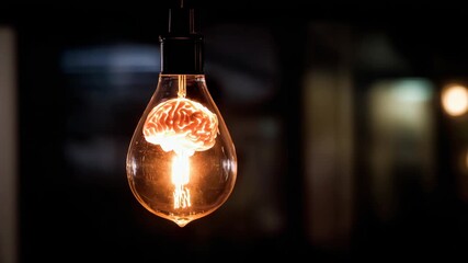 Surreal concept of human brain as light bulb emitting warm light in dark room