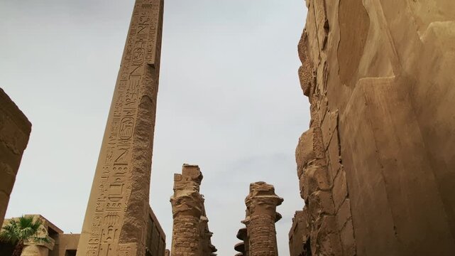 Queen Hatshepsut Obelisk and ruined pillars in Amun Temple, Karnak, Luxor. Handheld real-time footage