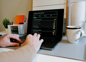 Male Information Technology Security Engineer Running Through an Internal Penetration Test Checklist Web Form - Corporate Cybersecurity Concept