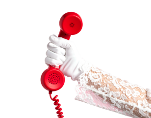 A gloved hand, adorned with lace, holds a bright red rotary phone receiver against a stark black background