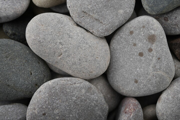 Close-up Of Smooth Grey And Reddish Pebbles And Rounded Stones On A Beach In Towyn, North Wales, Uk