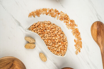 High-resolution commercial photo of roasted peanuts with a rich golden brown color and crisp texture. 