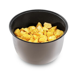 A gray multi-cooker or instant pot insert filled with raw, diced, seasoned yellow potato chunks, isolated on a white background.PNG