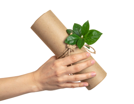 A hand holding a rolled-up brown paper scroll with green leaves tied with twine against a stark black background