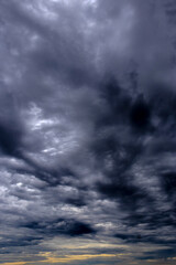 Dramatic sky with dark, dense Nimbostratus storm clouds. Ominous and moody atmosphere, signaling...