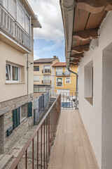 Fototapeta premium Overview of several village houses with gray granite facades, demonstrating the material and chromatic unity of the traditional town center.