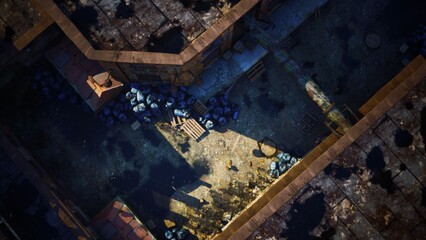 Aerial view showcases an abandoned urban environment with scattered debris and sunlight illuminating a secluded area. The contrast of shadows and texture tells a story of neglect and history.