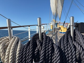 tall ship's sails through the rigging