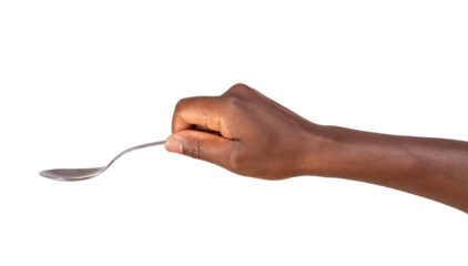 Close up of a man holding a spoon